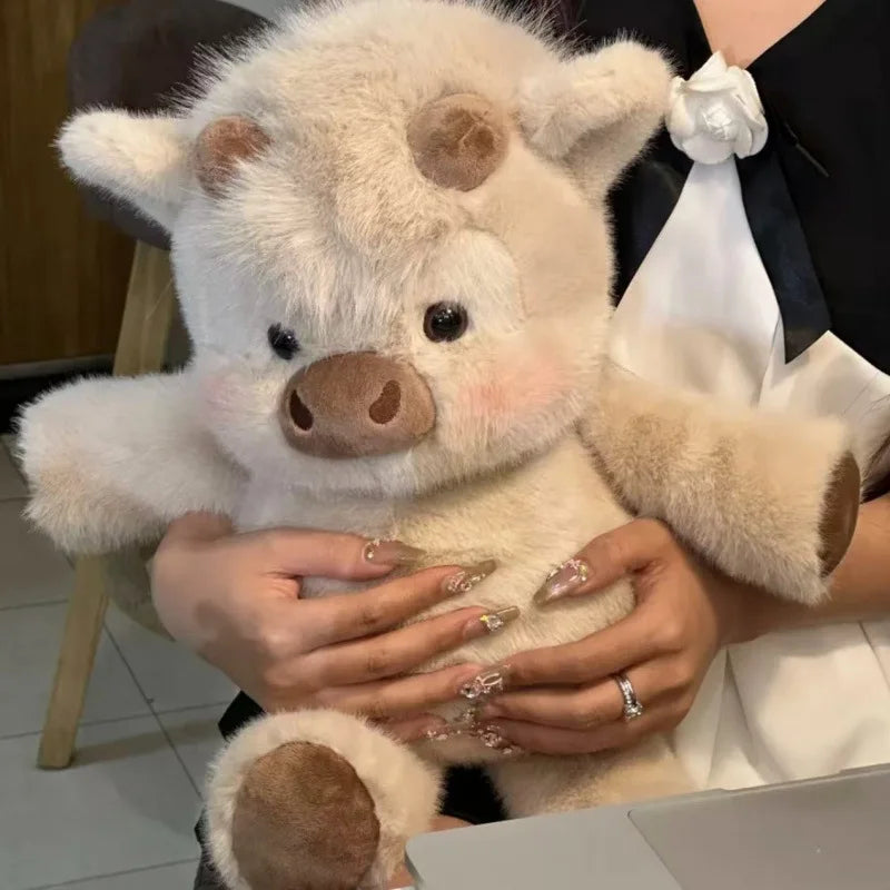Person holding the khaki fluffy Highland cow plush, 40cm