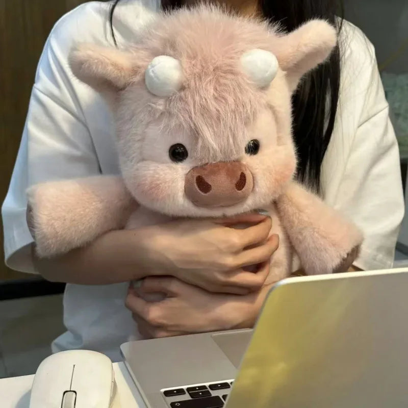 Person hugging the pink fluffy Highland cow plush, 40cm